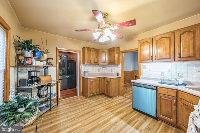 kitchen featuring dishwashing machine, light countertops, smart refrigerator, and brown cabinets