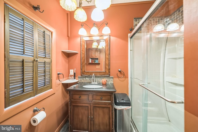 bathroom with vanity, backsplash, and a stall shower