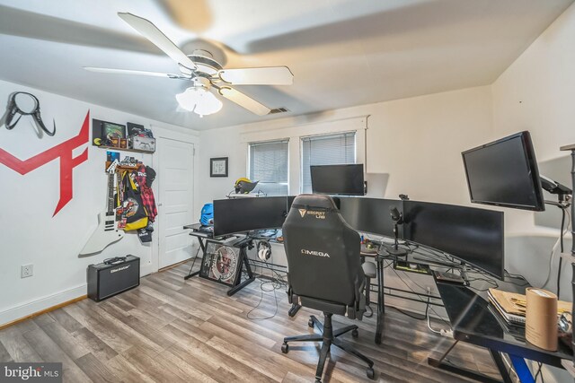 office with baseboards, ceiling fan, and wood finished floors