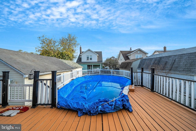 view of pool featuring a wooden deck