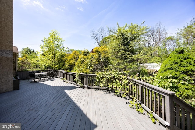 wooden deck with outdoor dining area