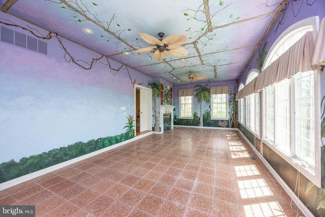 unfurnished sunroom with visible vents and baseboards