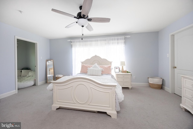 bedroom with light colored carpet, baseboards, and ceiling fan