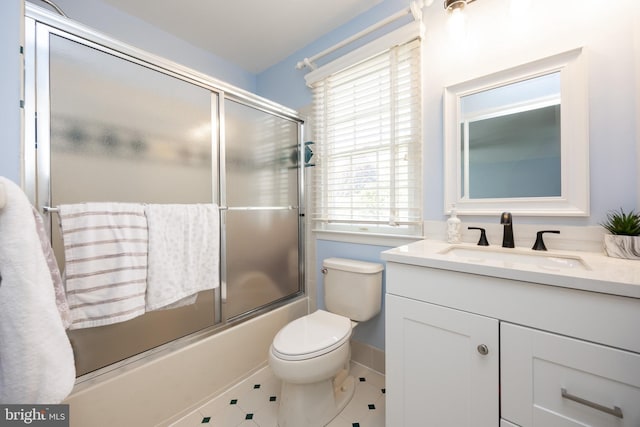 full bath with toilet, tile patterned flooring, vanity, and enclosed tub / shower combo