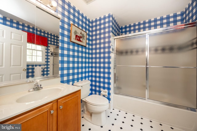 full bathroom with wallpapered walls, toilet, visible vents, shower / bath combination with glass door, and vanity