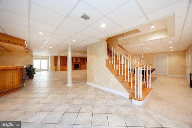 basement with recessed lighting, stairway, visible vents, and a paneled ceiling