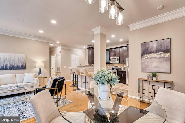 1530 Spring Gate Dr Unit 9208, Mclean, VA 22102 - dining space with crown molding, recessed lighting, light wood finished floors, baseboards, and ornate columns