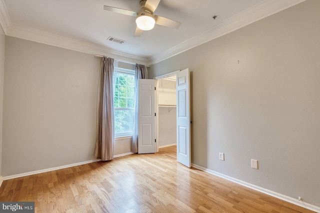 1530 Spring Gate Dr Unit 9208, Mclean, VA 22102 - unfurnished bedroom with light wood-style floors, ornamental molding, baseboards, a walk in closet, and a ceiling fan
