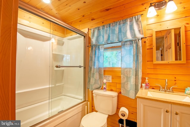 bathroom featuring toilet, wood walls, vanity, shower / bath combination with glass door, and wood ceiling