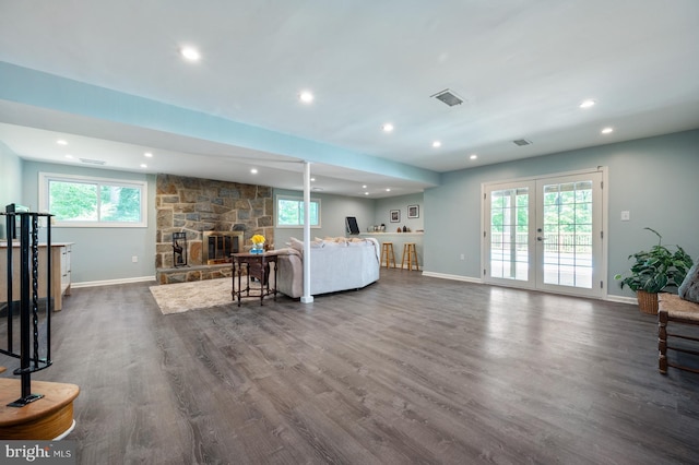 living room with baseboards, recessed lighting, and dark wood-style floors
