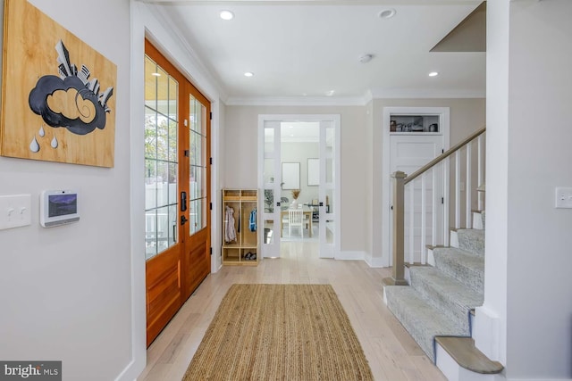 5116 Lawton Dr, Bethesda, MD 20816 - foyer featuring stairs, ornamental molding, wood finished floors, and recessed lighting