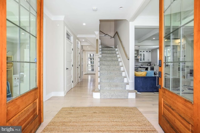 5116 Lawton Dr, Bethesda, MD 20816 - entryway featuring crown molding, stairs, wood finished floors, recessed lighting, and baseboards