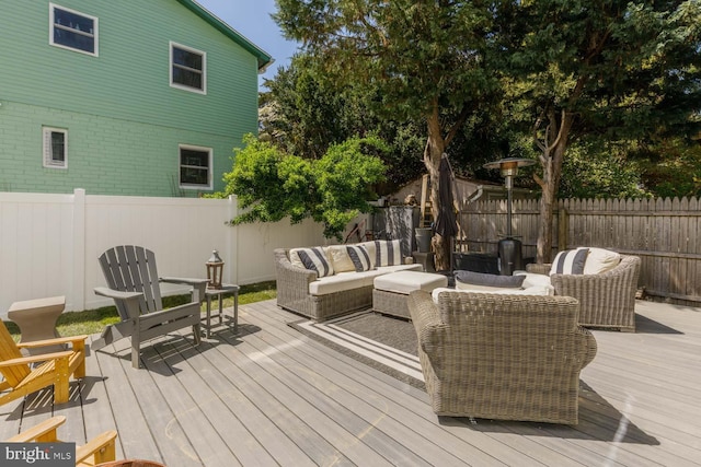5116 Lawton Dr, Bethesda, MD 20816 - deck with an outdoor hangout area and a fenced backyard