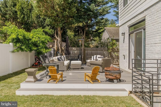 5116 Lawton Dr, Bethesda, MD 20816 - view of patio with a fenced backyard, an outdoor living space with a fire pit, and a deck