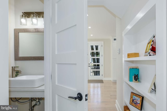 5116 Lawton Dr, Bethesda, MD 20816 - corridor with a sink and wood finished floors