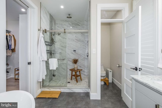 5116 Lawton Dr, Bethesda, MD 20816 - full bath with a marble finish shower, tile patterned floors, recessed lighting, vanity, and toilet