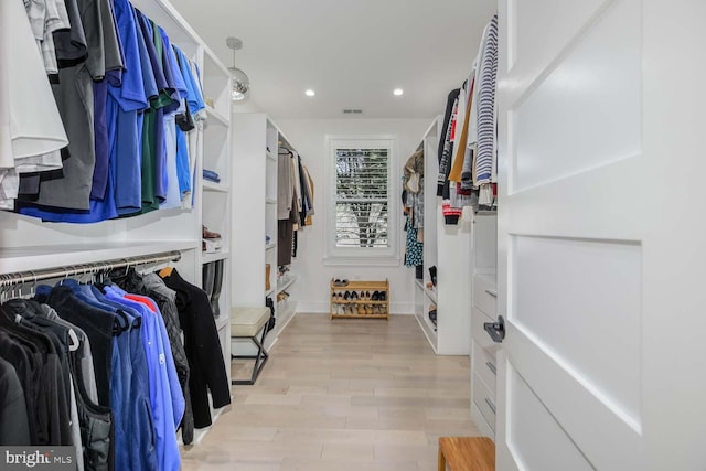 5116 Lawton Dr, Bethesda, MD 20816 - walk in closet with light wood-style flooring