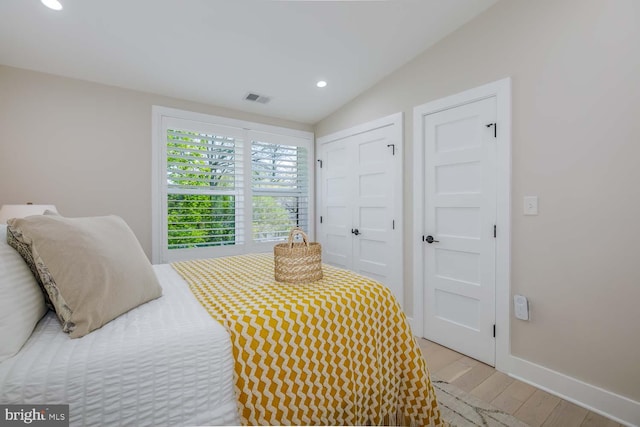 5116 Lawton Dr, Bethesda, MD 20816 - bedroom featuring wood finished floors, vaulted ceiling, recessed lighting, baseboards, and a closet