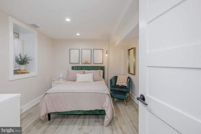 5116 Lawton Dr, Bethesda, MD 20816 - bedroom with light wood finished floors, baseboards, and recessed lighting
