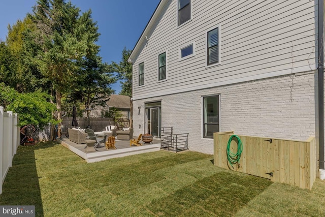 5116 Lawton Dr, Bethesda, MD 20816 - back of property with an outdoor hangout area, brick siding, and a patio