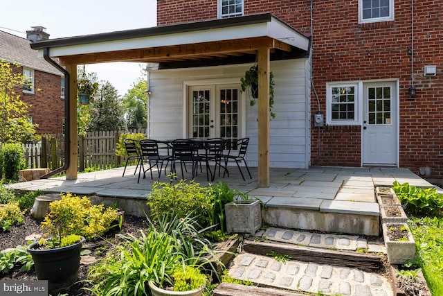exterior space with fence and french doors