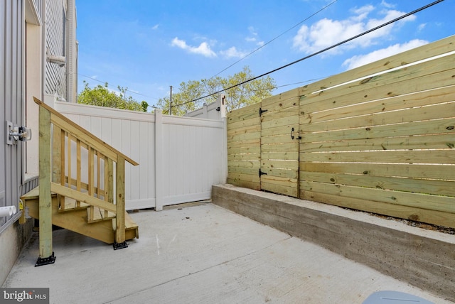 view of patio featuring fence