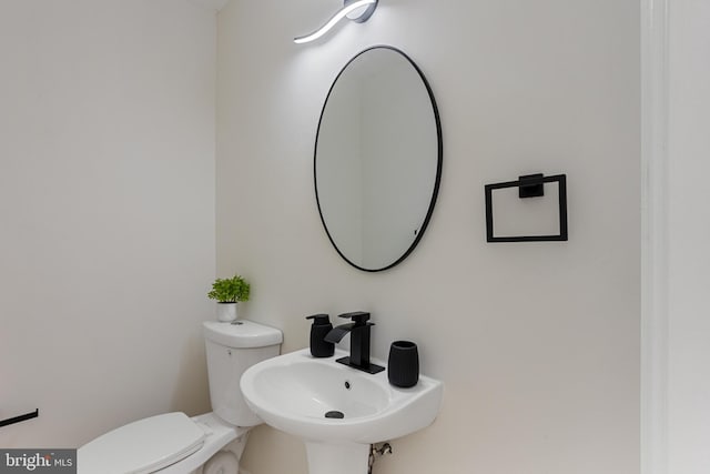 bathroom with a sink and toilet