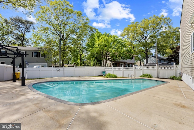 view of pool featuring fence, a fenced in pool, and a patio area