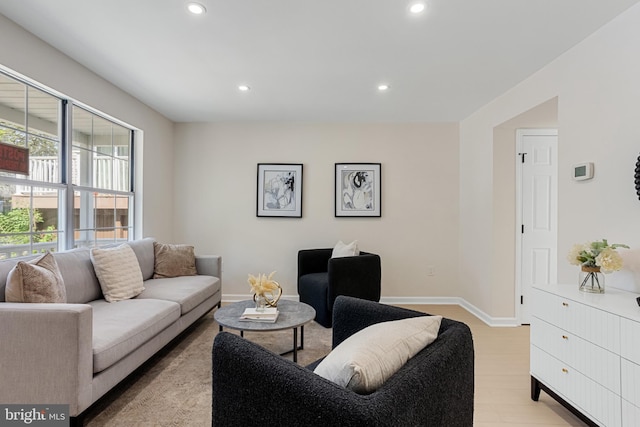living room with recessed lighting and baseboards