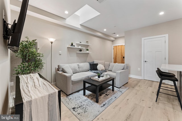 818 Kennedy St NW Unit 9, Washington, DC 20011 - living room featuring recessed lighting, light wood-style floors, baseboards, and a skylight