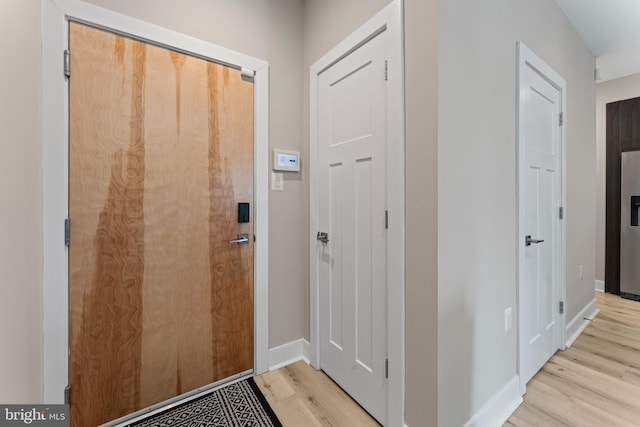 818 Kennedy St NW Unit 9, Washington, DC 20011 - doorway to outside featuring light wood-type flooring and baseboards