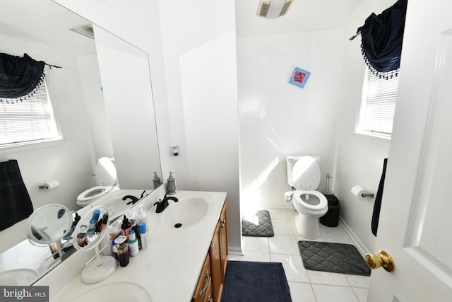 1117 Sterling Pl, Lancaster, PA 17603 - bathroom featuring tile patterned flooring, a sink, a wealth of natural light, and toilet