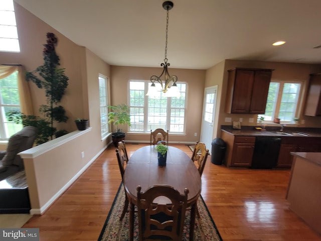 402 Waltham Dr, Middletown, DE 19709 - dining area with an inviting chandelier, recessed lighting, light wood-style flooring, and baseboards