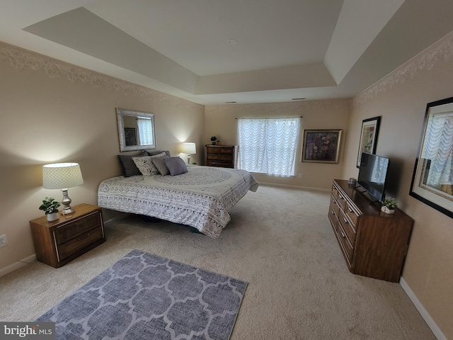 402 Waltham Dr, Middletown, DE 19709 - bedroom with baseboards, a tray ceiling, and light carpet