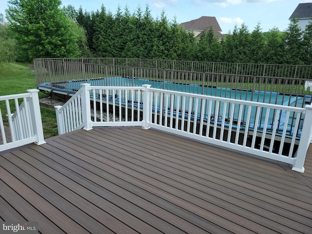 402 Waltham Dr, Middletown, DE 19709 - wooden terrace featuring a fenced in pool and fence