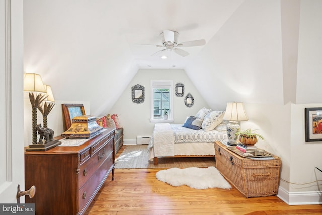 835 Beechwood Rd, Havertown, PA 19083 - bedroom with baseboards, light wood-style flooring, lofted ceiling, a baseboard radiator, and a ceiling fan