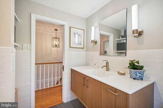 835 Beechwood Rd, Havertown, PA 19083 - bathroom with a wainscoted wall, tile walls, vanity, and a chandelier