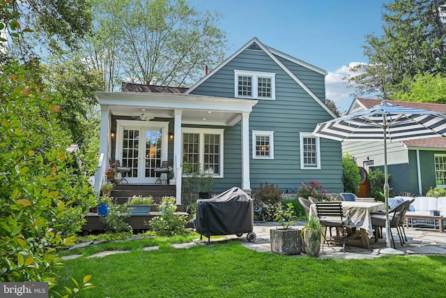 835 Beechwood Rd, Havertown, PA 19083 - rear view of property featuring a lawn and a patio