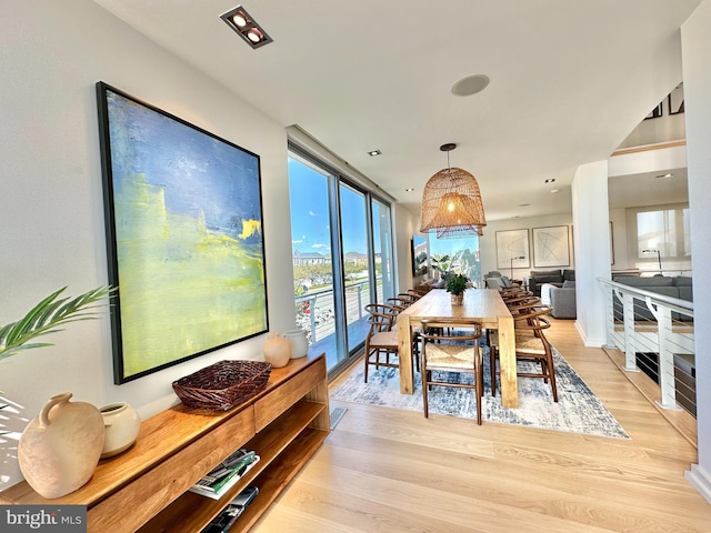 dining space featuring light wood-style flooring