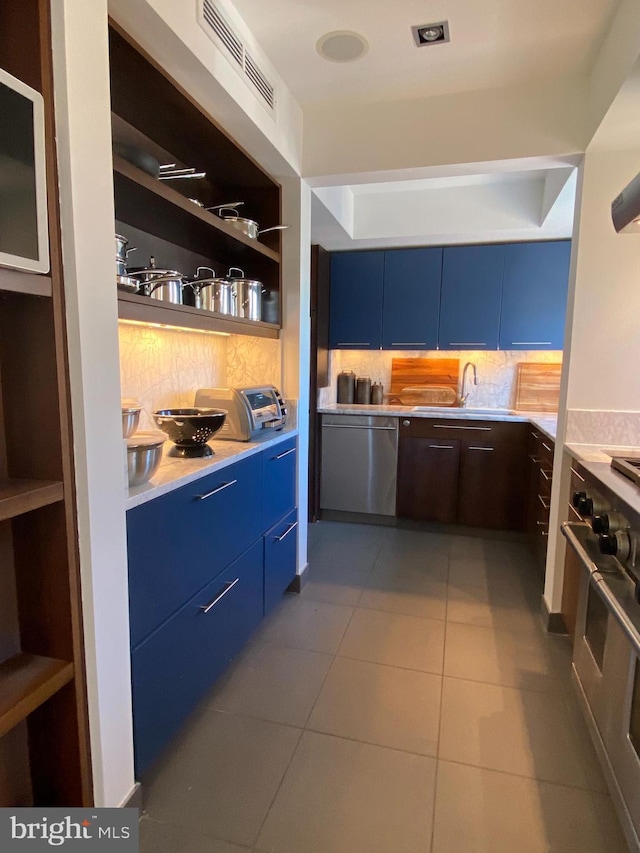 interior space with dishwasher, decorative backsplash, modern cabinets, and blue cabinets