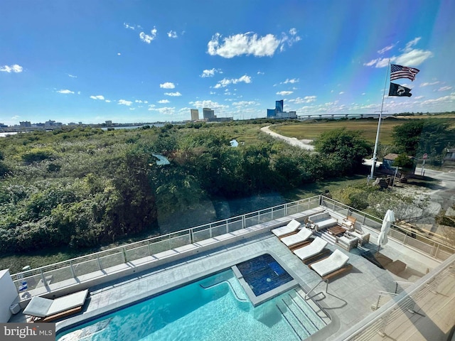 view of swimming pool with fence, a fenced in pool, and a patio area