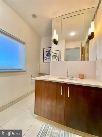 bathroom featuring tile patterned floors and vanity