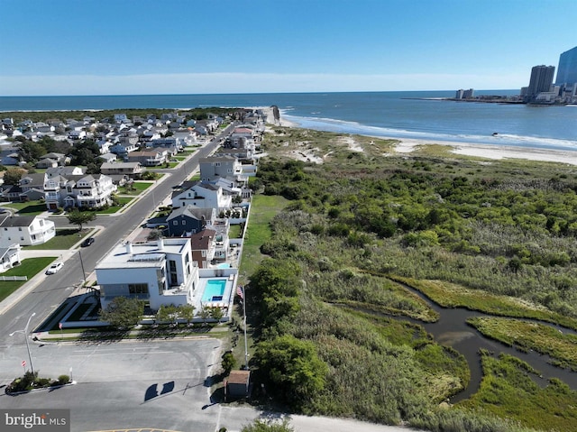 bird's eye view with a beach view and a water view