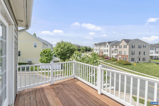 wooden terrace featuring a residential view