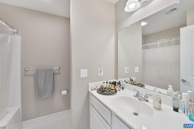 bathroom with vanity, tile patterned flooring, curtained shower, and visible vents