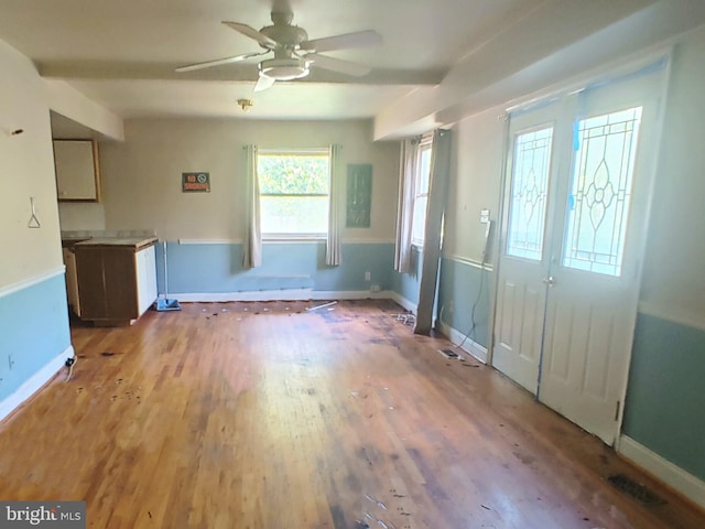 entrance foyer featuring visible vents, a ceiling fan, light wood finished floors, and baseboards