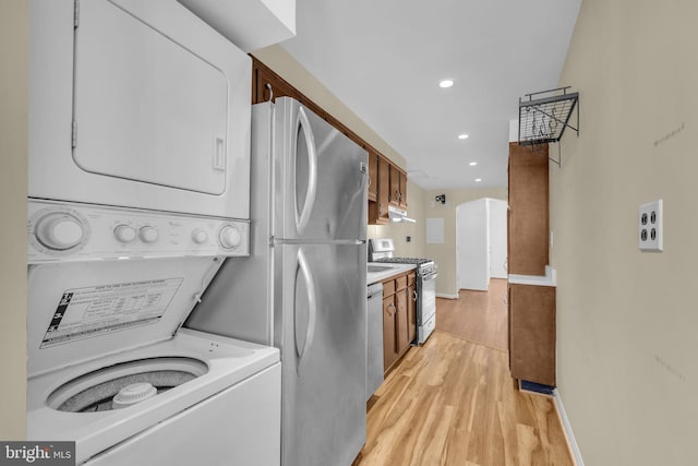 945 Randolph St NW Unit A, Washington, DC 20011 - washroom with stacked washer / dryer, light wood finished floors, recessed lighting, and baseboards