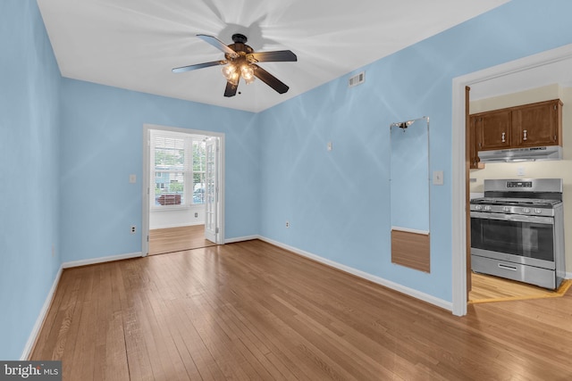 945 Randolph St NW Unit A, Washington, DC 20011 - unfurnished living room with light wood finished floors, ceiling fan, and baseboards