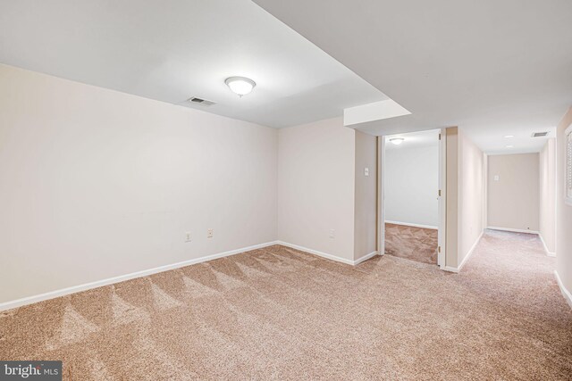 interior space featuring visible vents, carpet, and baseboards