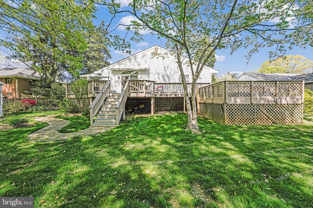 view of yard featuring stairs and a deck